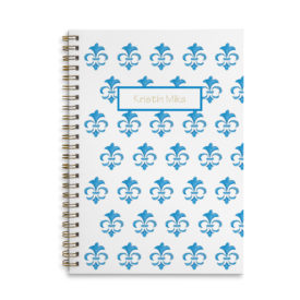 fleur de lis spiral bound notebook with blank pages.