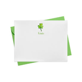 Flat white notecard with a green shamrock image that can be personalized printed on white paper.